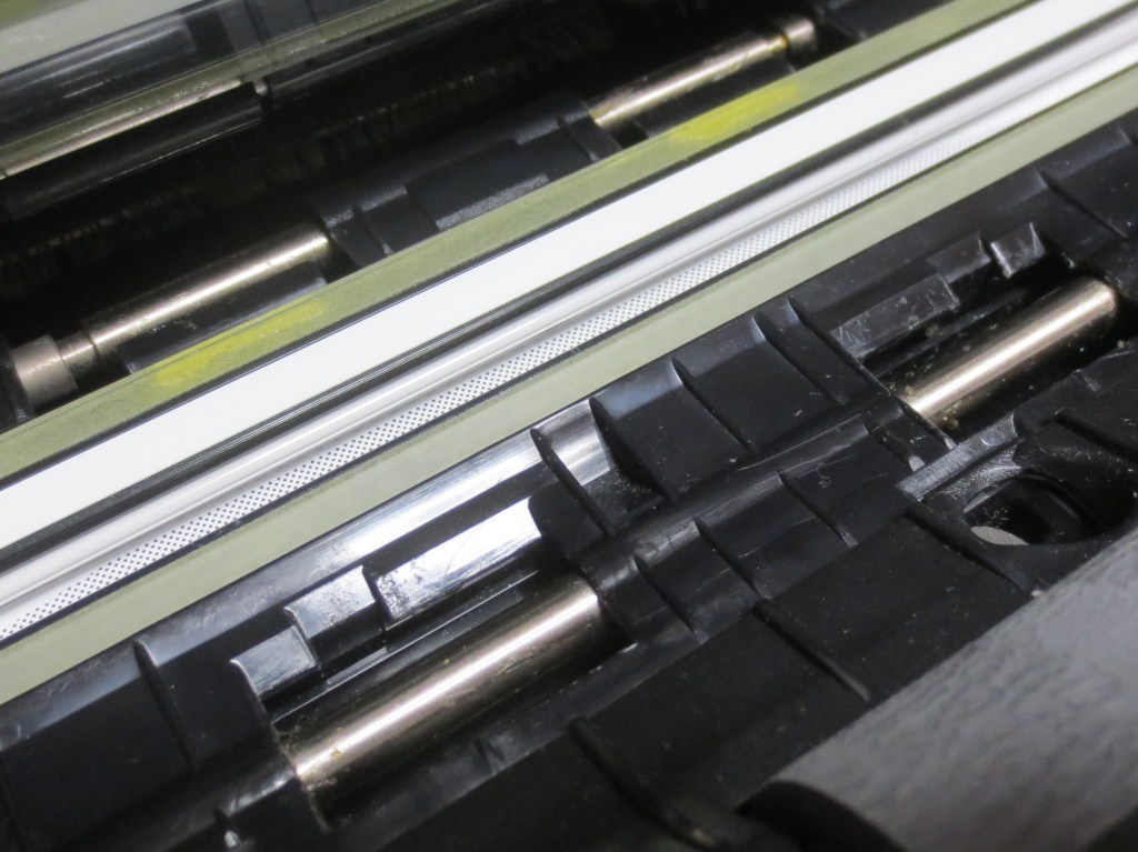 スキャナの溶けたローラーを除去